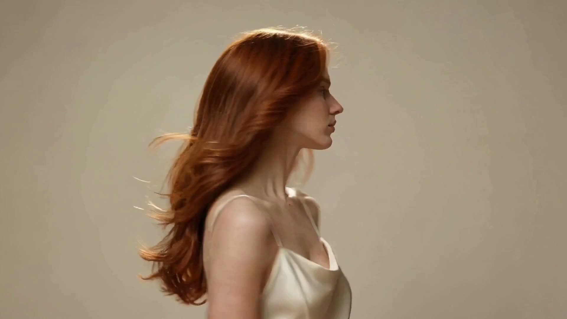 Blush-toned crop of flowing auburn hair — Mara's profile image